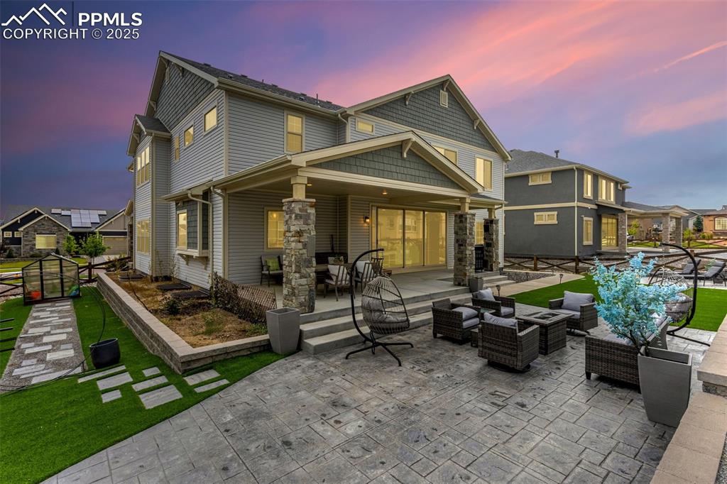 Huge concrete stamped patio plus greenhouse and gardening area with custom walkway and circular metal garden trellis!