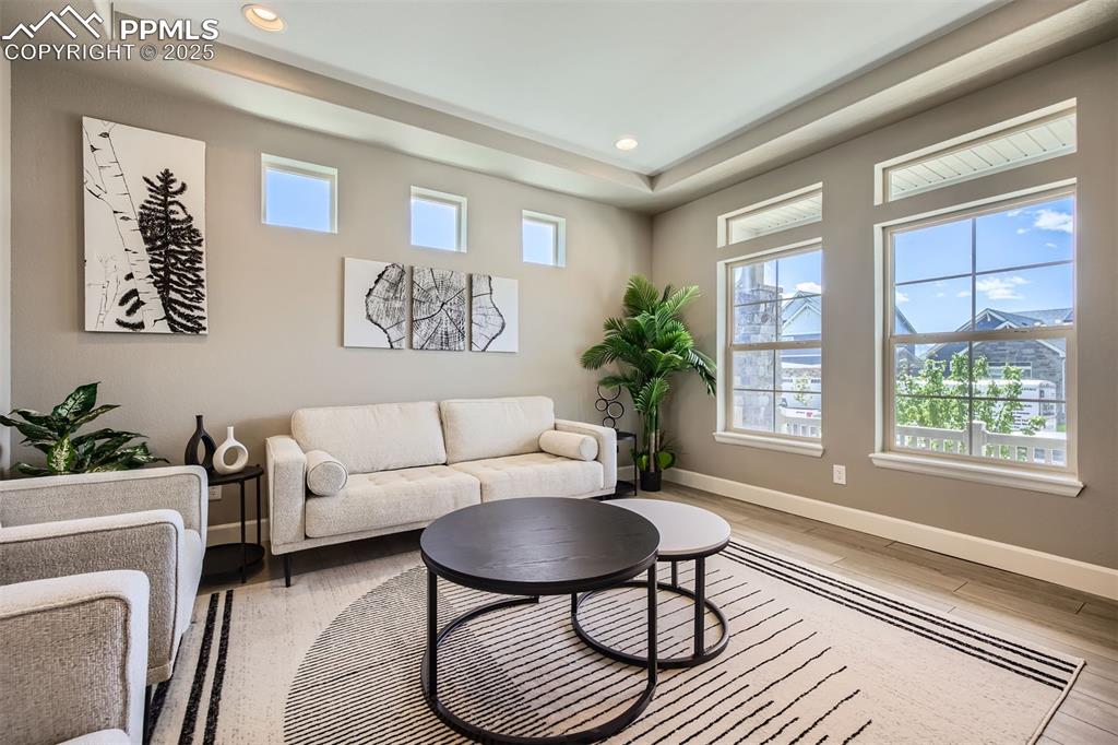Front Living Room with Tray Ceilings opens to formal dining area