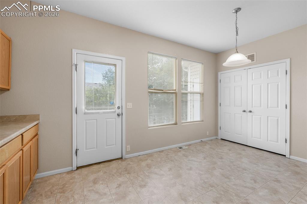 Unfurnished dining area featuring healthy amount of natural light
