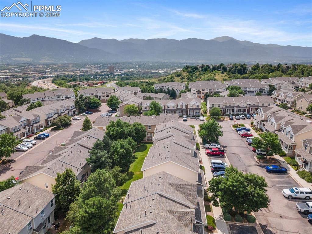 Aerial view of residential area featuring a mountainous background