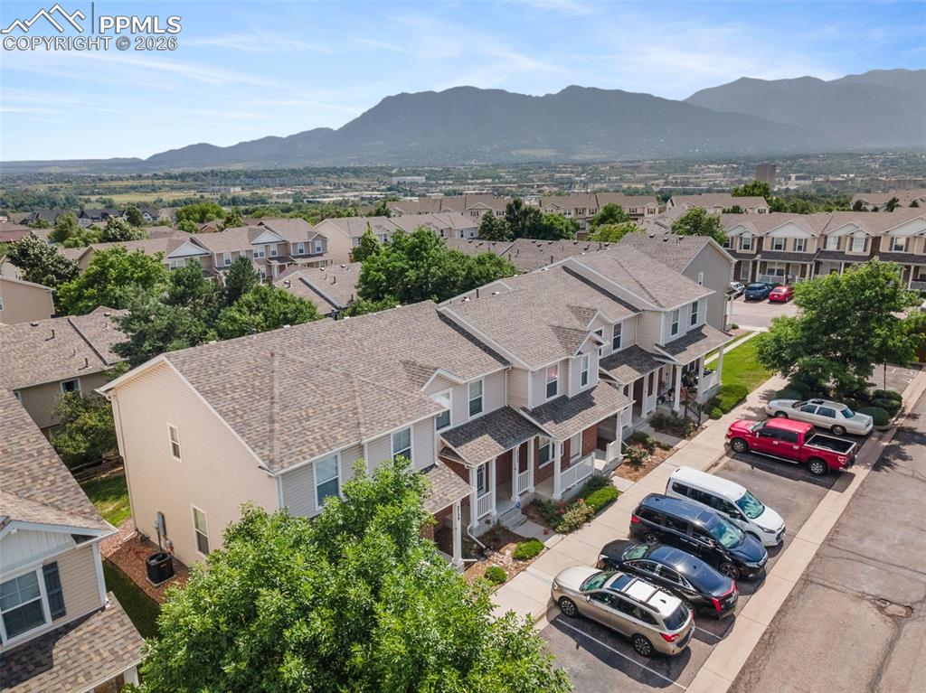 Aerial perspective of suburban area with a mountain backdrop