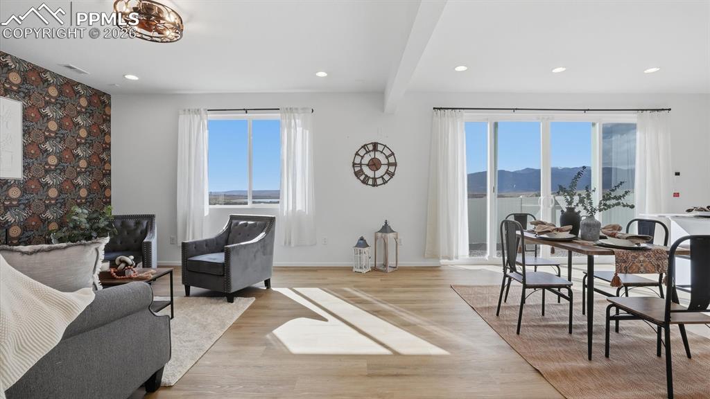 The Great Room flows seamlessly into the Dining Area and overlooks the backyard.