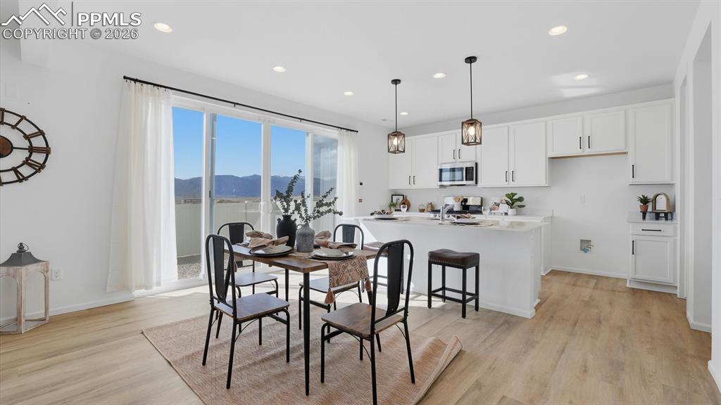 The Dining Area has a slider to the fenced backyard.