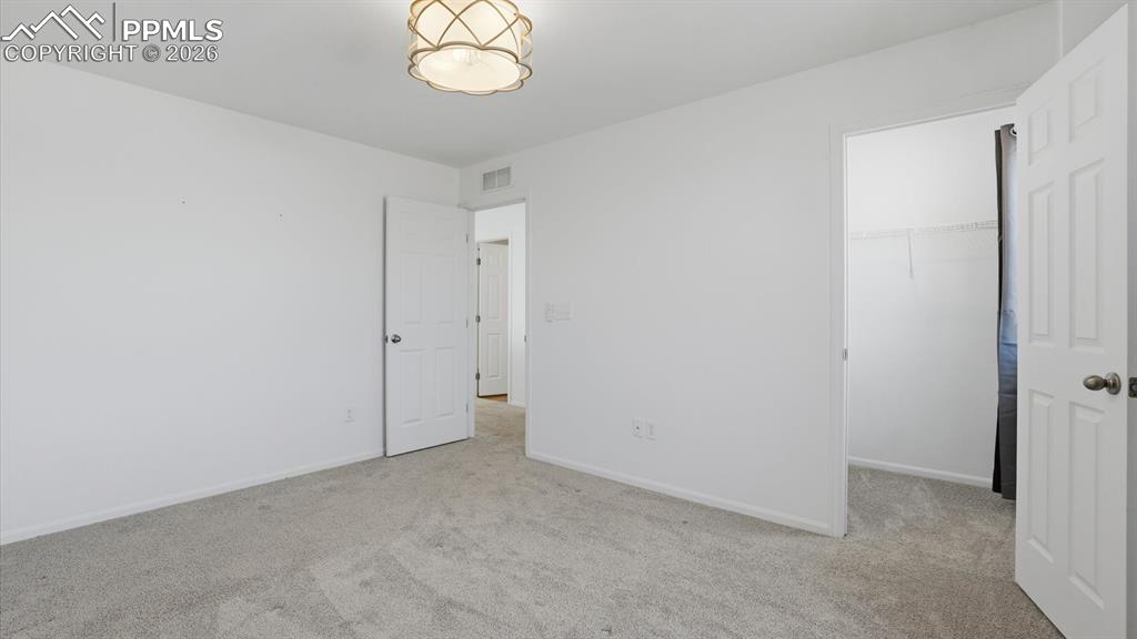 Upper level Bedroom #3 with walk in closet.