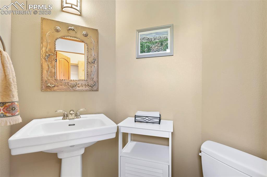 Bathroom featuring double vanity, a garden tub, and light tile patterned floors