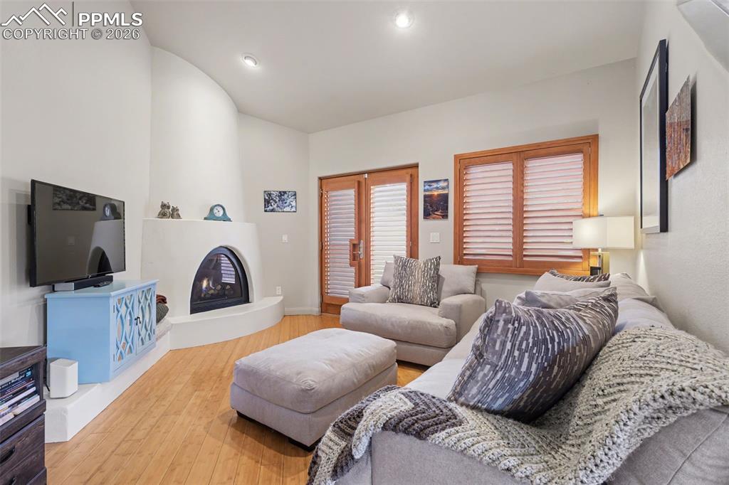 Kitchen with a mountain view, light stone counters, and stainless steel stovetop