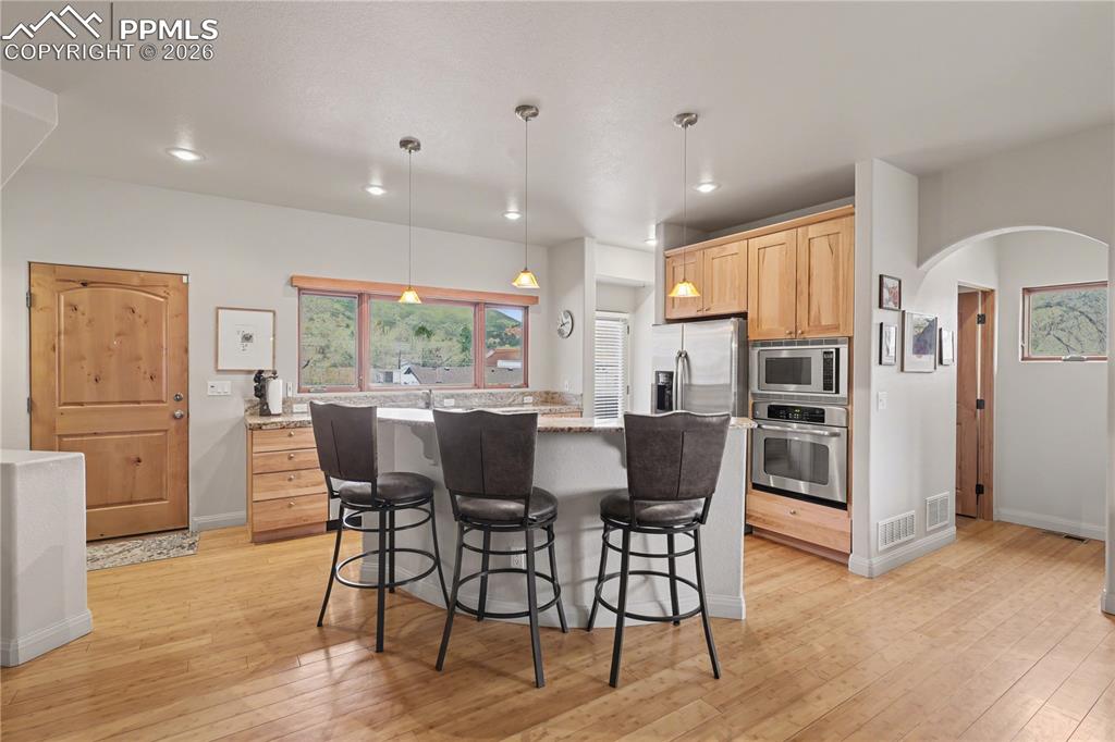 Office area featuring light wood-type flooring and baseboards