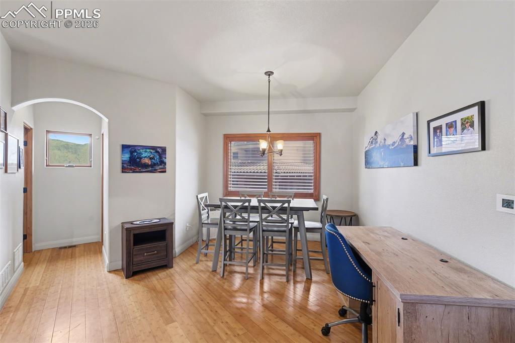 Wooden terrace with a hot tub and a mountain view