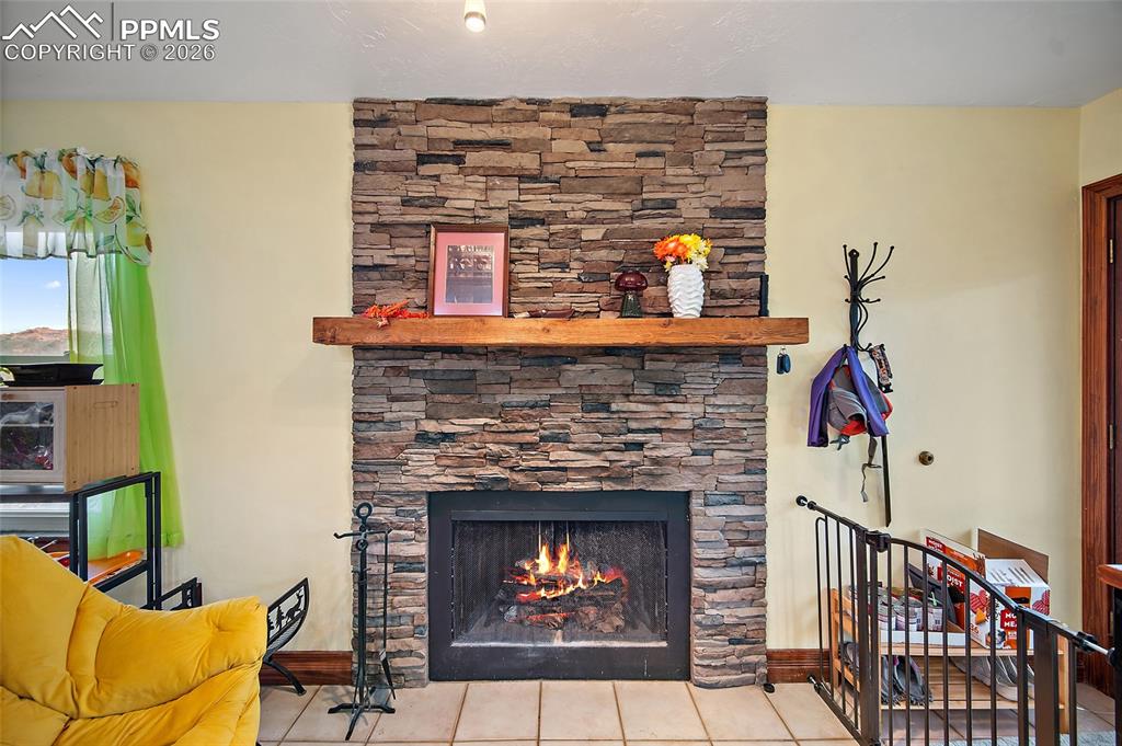 Fireplace in family room open to kitchen.