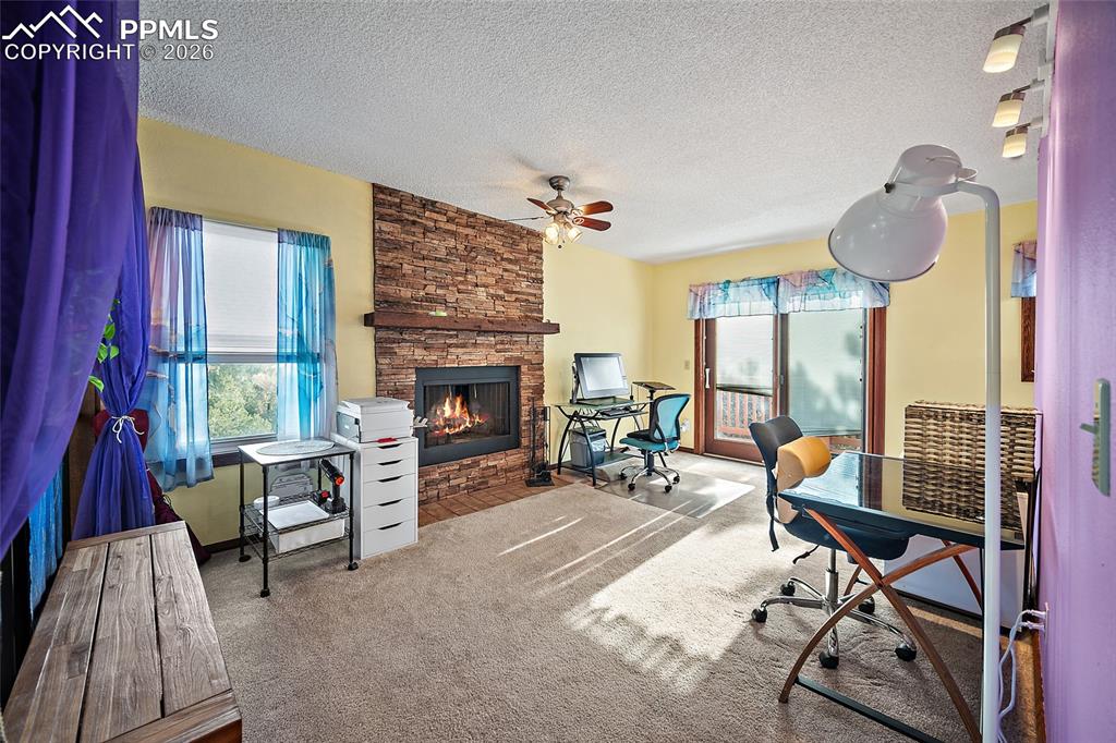 Upstairs office/extra space overlooks main floor. Double doors lead to read top deck overlooking front range.