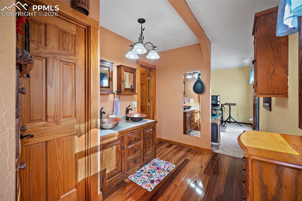 Master Bathroom leading to office/extra space in background.