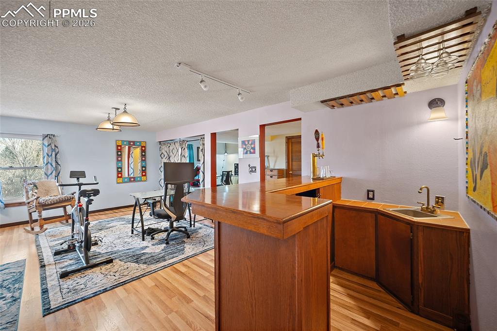 Reverse view of bar & wet bar with built in kegerator system.