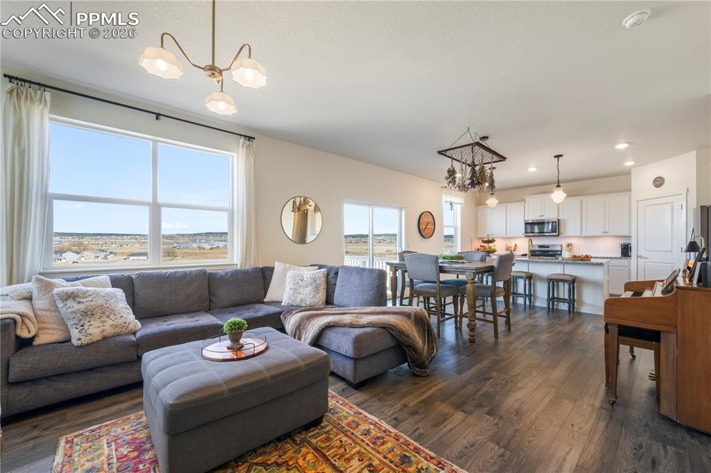 Main level living room with abundant light, gas fireplace