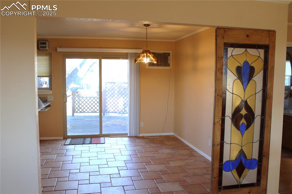 Dining area featuring crown molding