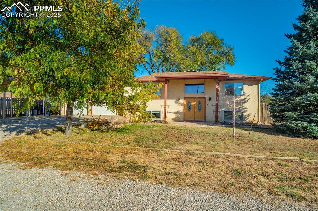 View of front of property featuring stucco siding