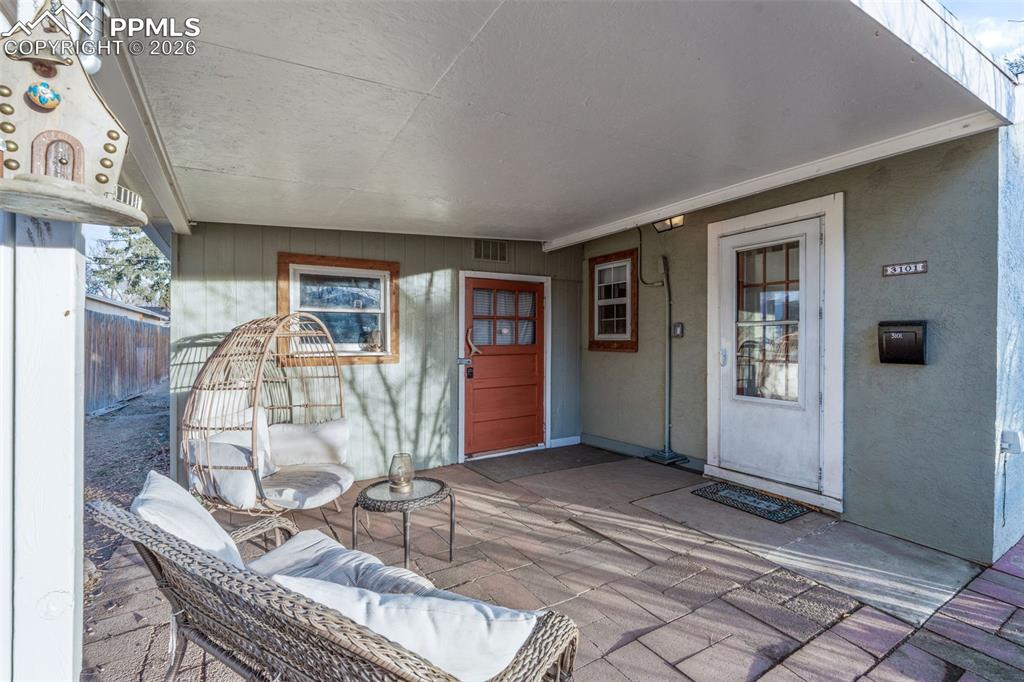 View of exterior entry featuring a patio