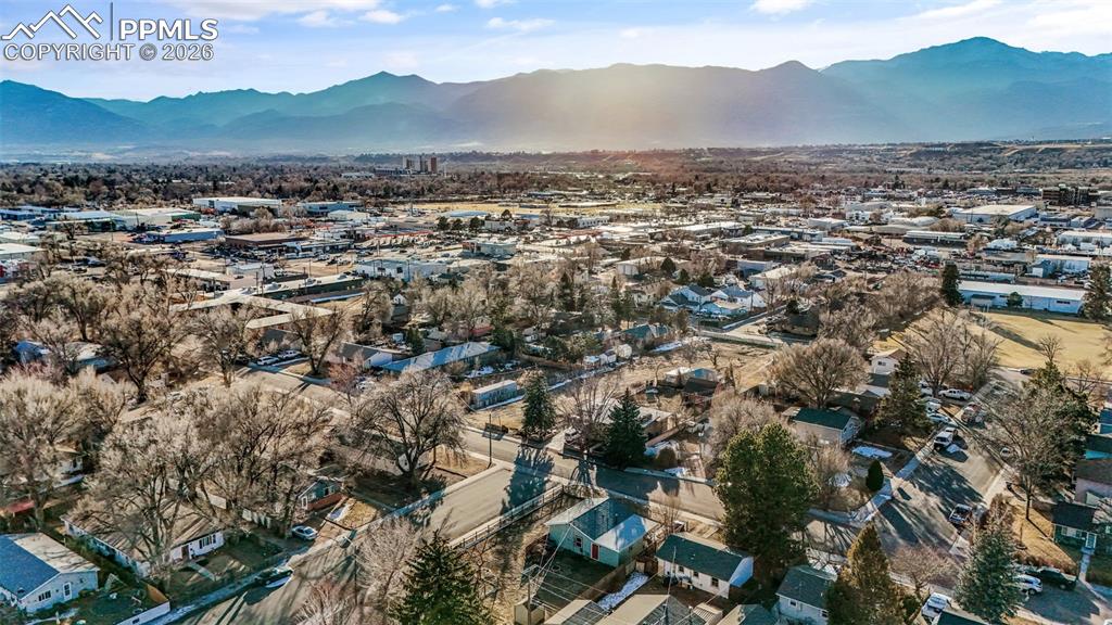 Aerial view of residential area featuring mountains