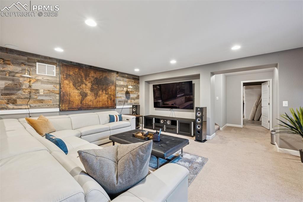 Living area featuring carpet floors and recessed lighting