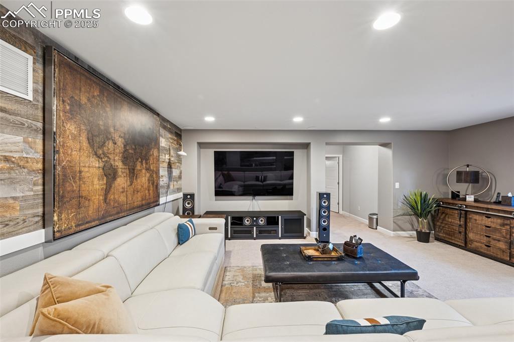 Living area featuring recessed lighting and light colored carpet