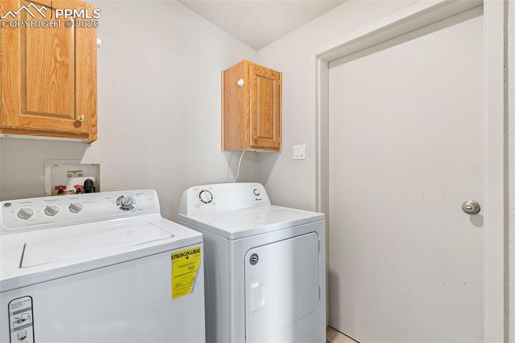 Laundry is located between the garage and the full hall bath