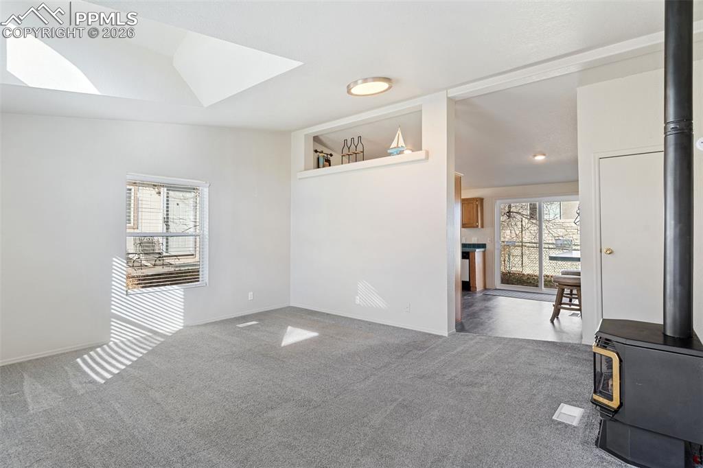 The view from the front door looking into the kitchen.  Note the NEW sliding glass door. 