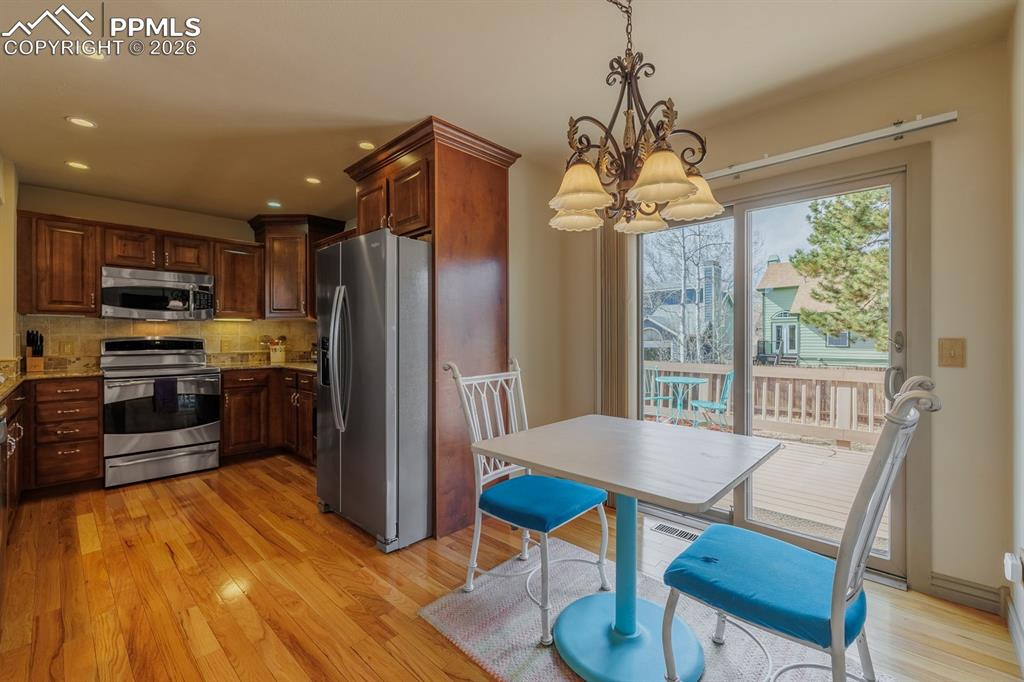 Nook for a quick breakfast and walk out to deck and yard