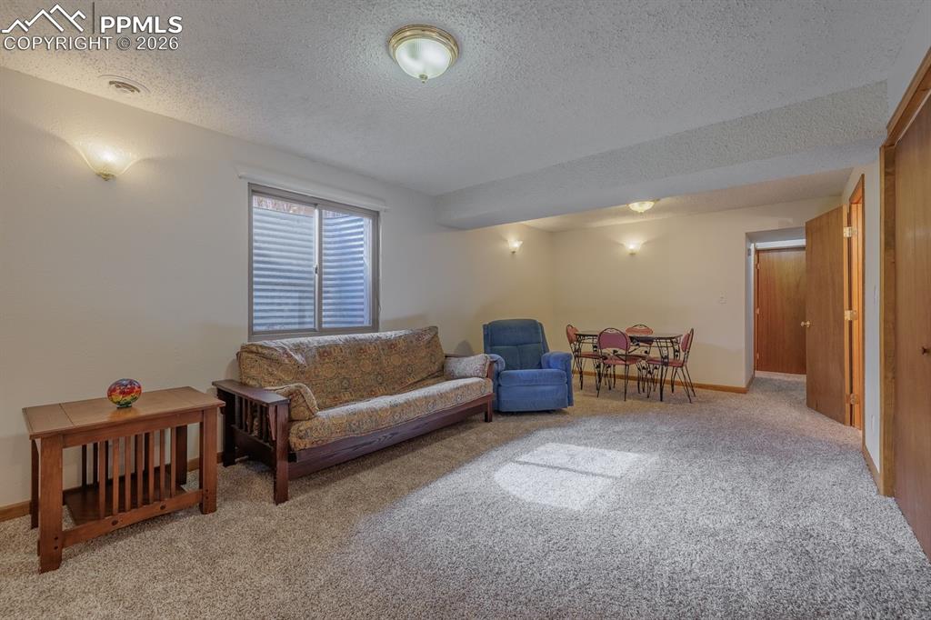 Basement family room with laundry area, half bath/sauna and bedroom or office