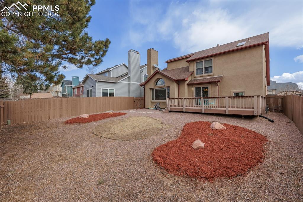 Newly painted fence and great yard with grass area nad xeriscaping.Drip and sprinkler systems