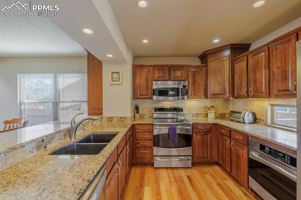 Fabulous gourmet kitchen with range oven, induction cook top, wall oven, GE appliances and new refrigerator