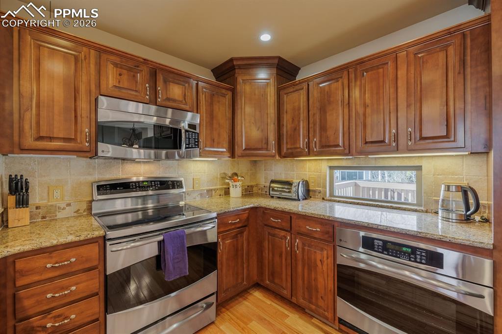 Custom cabinetry with soft close drawers and pull-outs for heavy pots