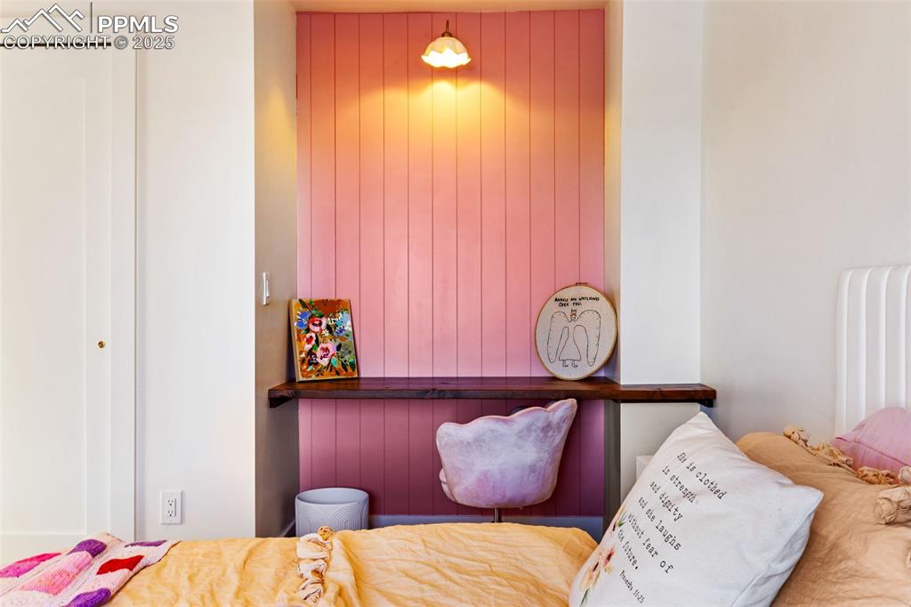 Bedroom with wooden walls