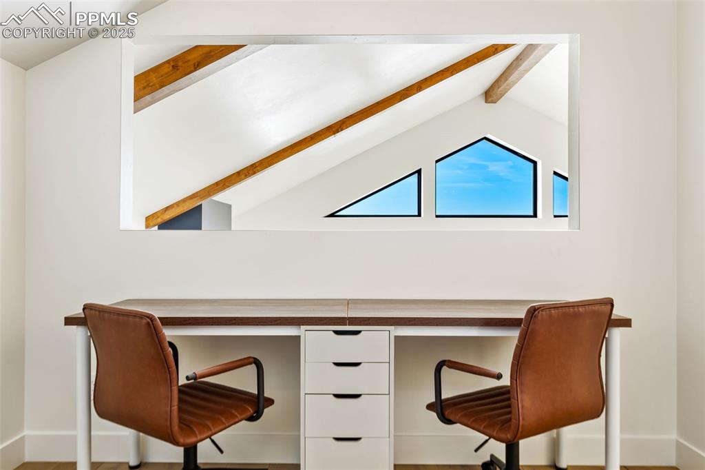 Office with baseboards and wood finished floors