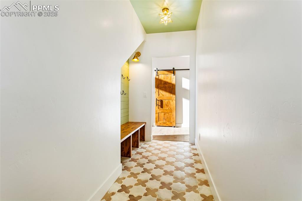 Mudroom featuring baseboards