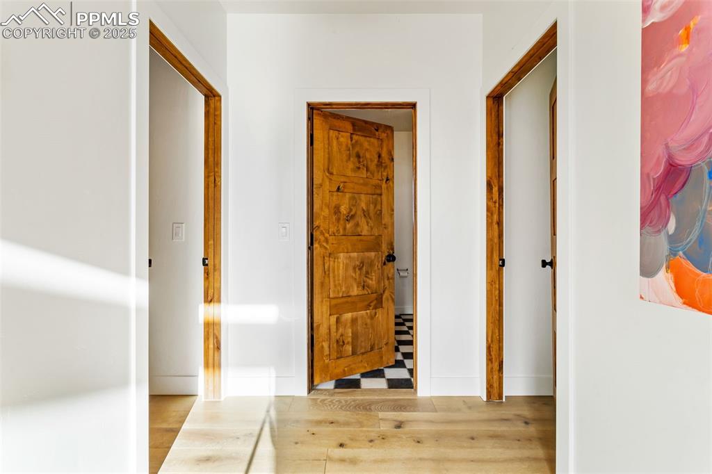 Hallway with wood finished floors