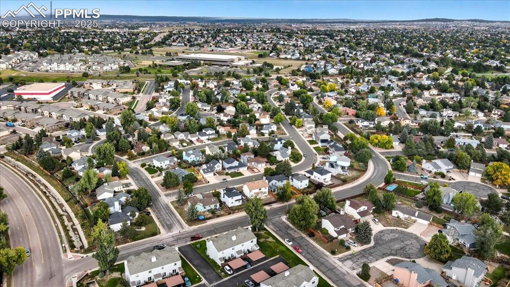 Aerial overview of property's location featuring nearby suburban area