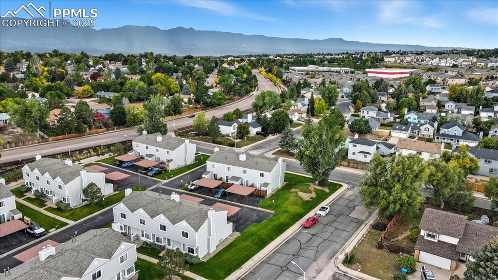 Aerial perspective of suburban area with a mountain backdrop
