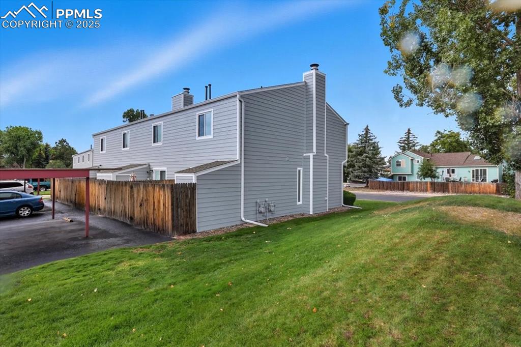 Back of house featuring a chimney
