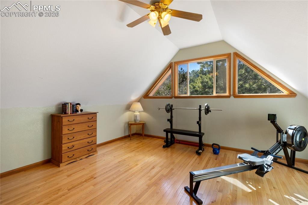 Second level bedroom is large currently used as work out area, vaulted ceilings, hard wood floors, 3 windows, let the mountain air come in