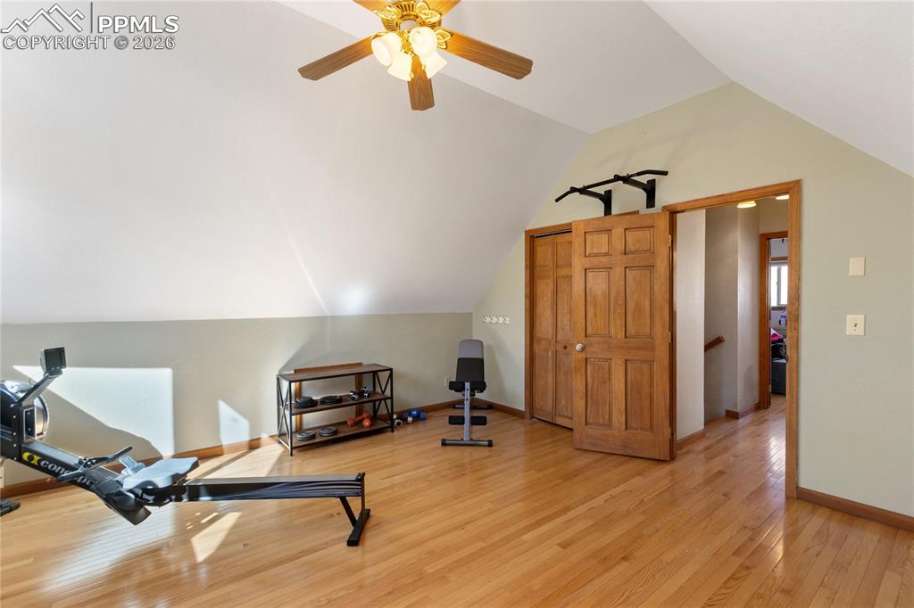 Second level bedroom is large currently used as work out area, vaulted ceilings, hard wood floors, 3 windows, let the mountain air come in