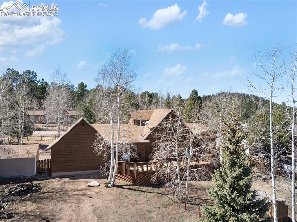 Backyard is large enough for all activities and gatherings, home stands tall with classic woodland park design.