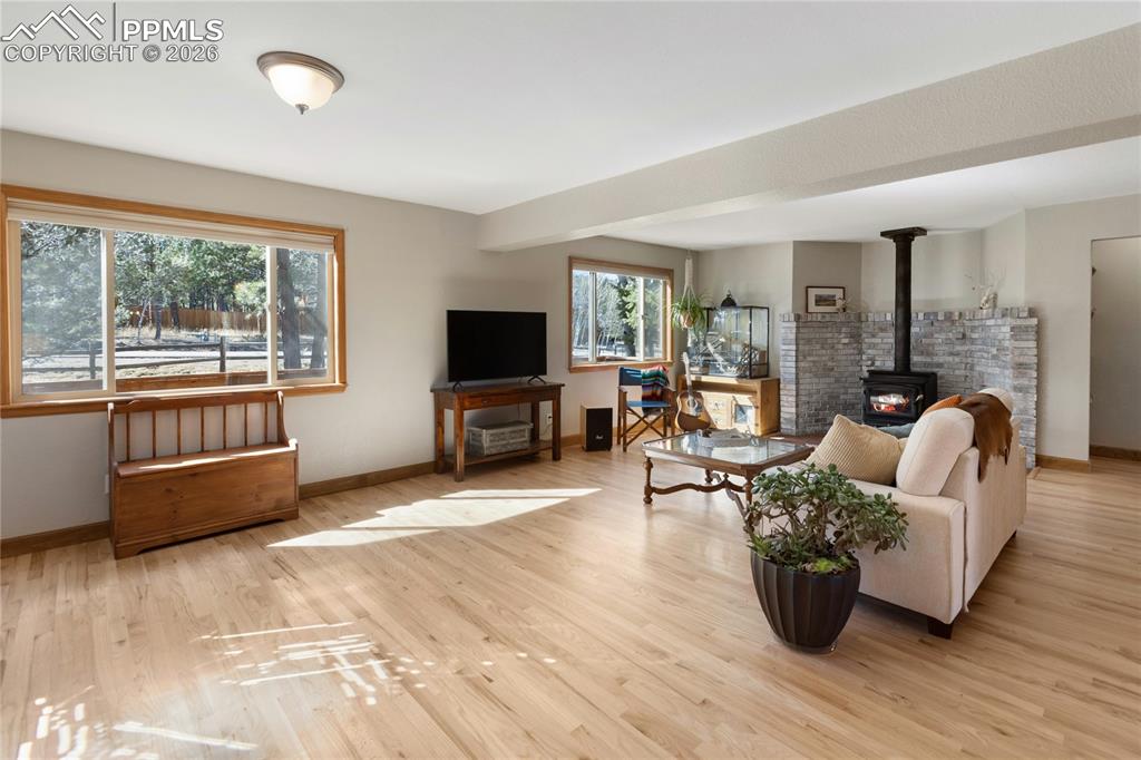 Hard wood floors throughout! Wood Buring fireplace, open concept, natural light