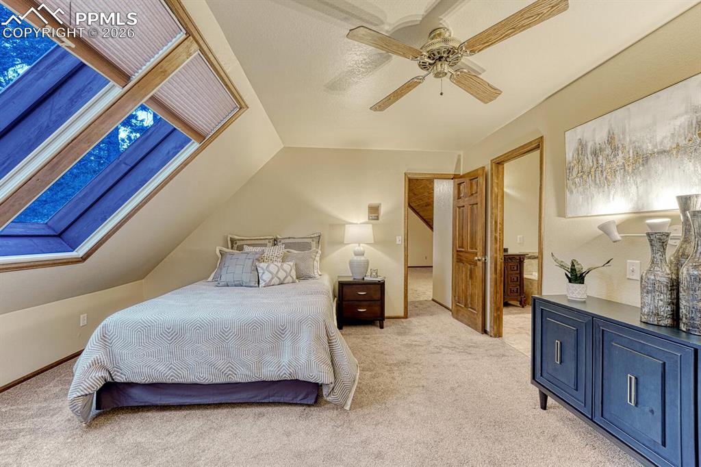 Primary bedroom with passive solar  and ceiling fan