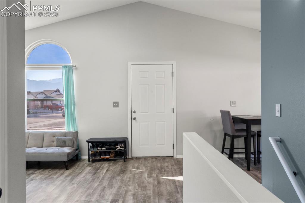 Entrance featuring wood finished floors