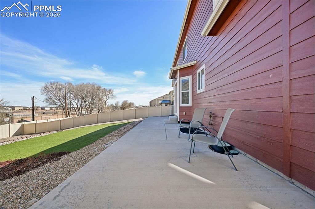 Concrete wraps around to side of home