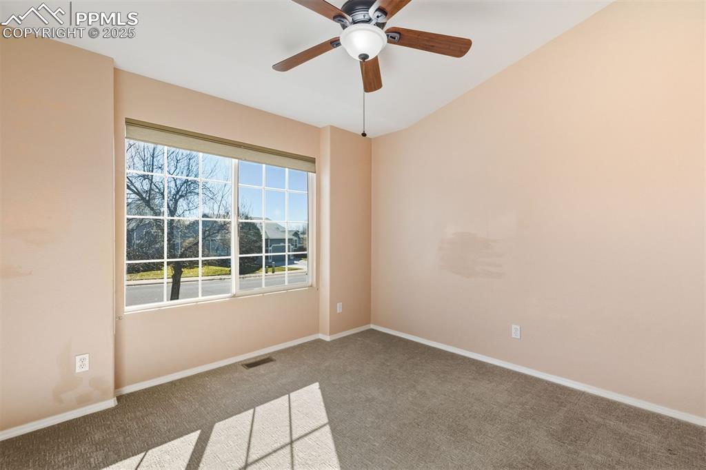 Light filled main level bedroom that can also work as a wonderful office. 