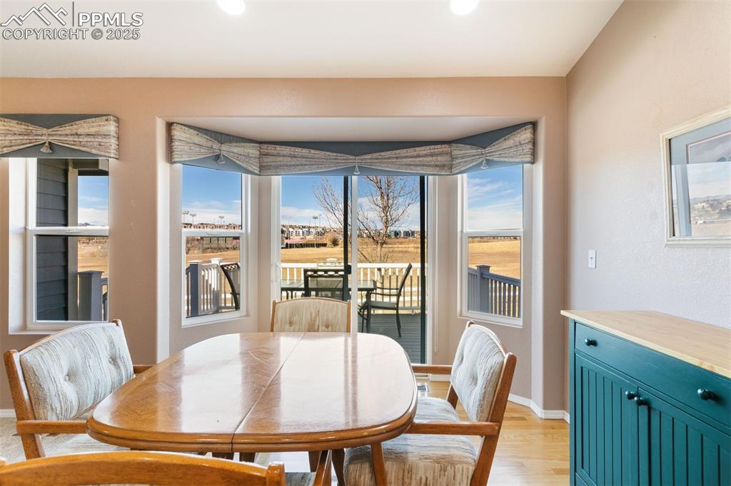Charming breakfast nook that opens to the composite deck, perfect for easy indoor outdoor living.
