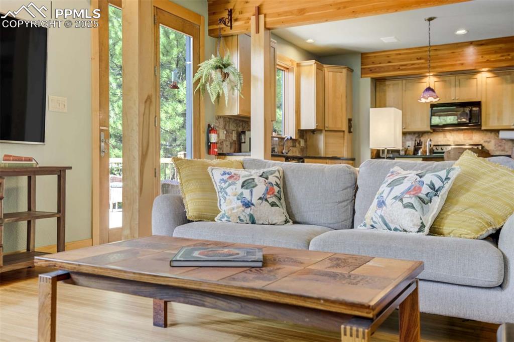 Living room with recessed lighting and wood beams