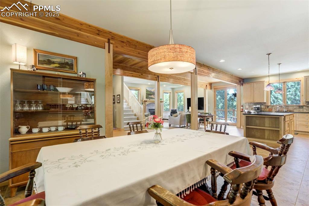 Comfortable spacios dining room with a healthy amount of natural light.