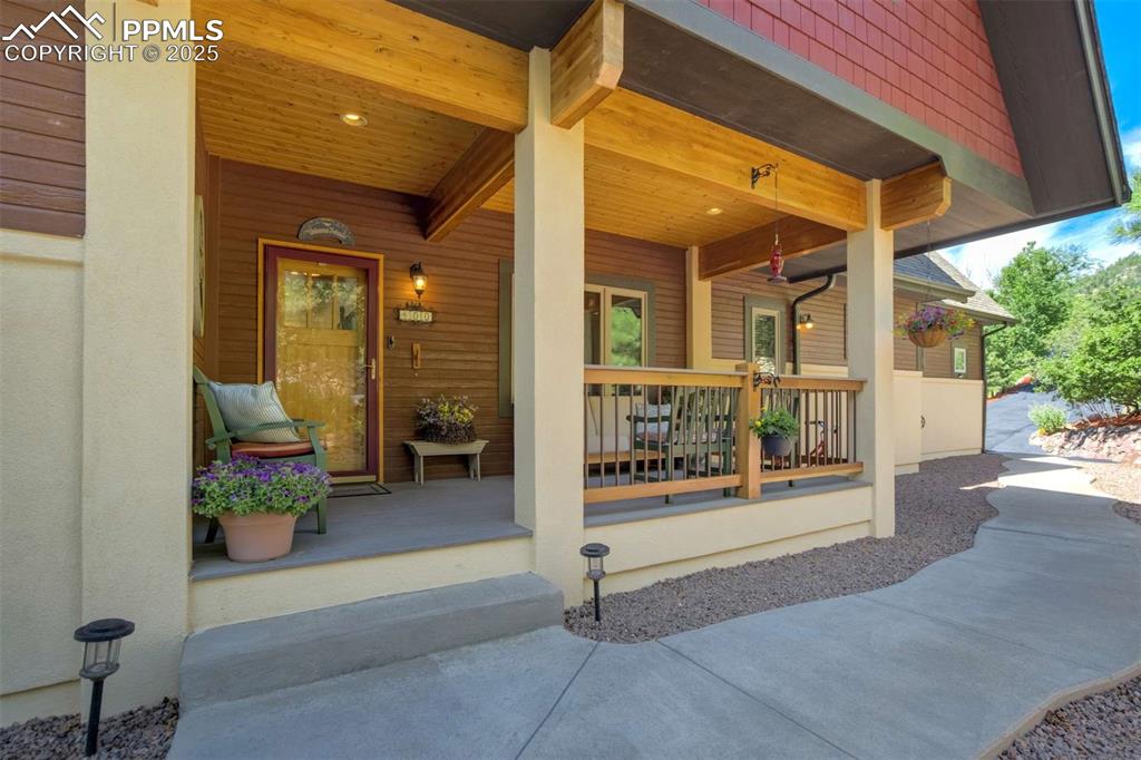 Property entrance featuring a covered front porch 