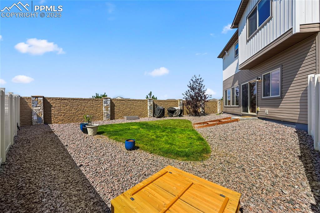 View of fenced backyard